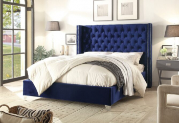 A luxurious ottoman bed featuring a wingback headboard in plush velvet blue. The elegant design adds a touch of sophistication to any bedroom decor.